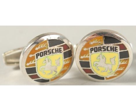A PAIR OF STERLING SILVER AND ENAMEL PORSCHE EMBLEM CUFFLINKS.