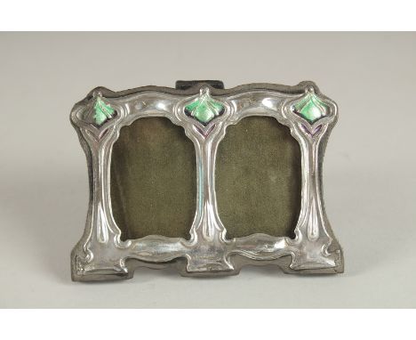 A SMALL SILVER AND ENAMEL DOUBLE PHOTOGRAPH FRAME. 2.75ins x 3.75ins.