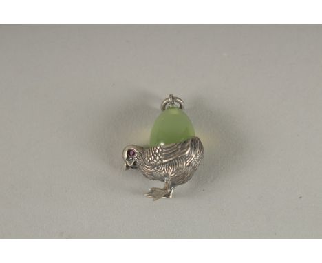 A JADE CHICK PENDANT.