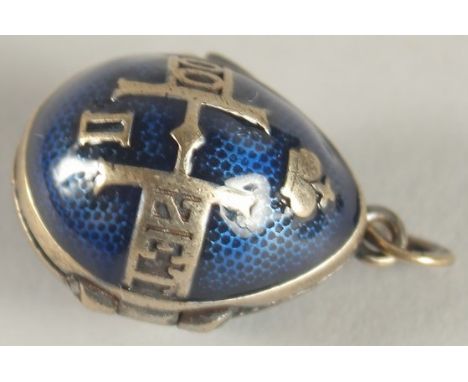 A SILVER AND BLUE ENAMEL EGG SHAPED LOCKET.