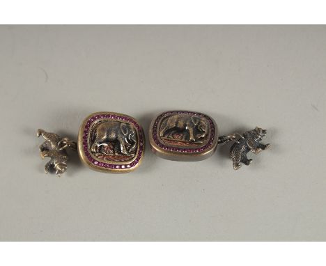 A GOOD PAIR OF RUSSIAN SILVER AND RUBY ELEPHANT CUFFLINKS. Head 88 A. H. Faberge.