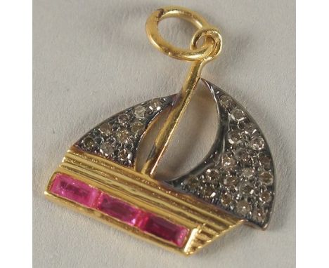 A SMALL DIAMOND AND RUBY BOAT CHARM.