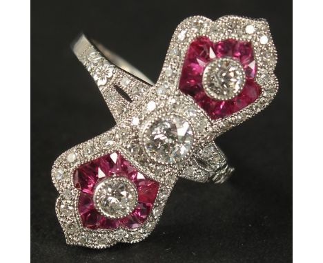 A PLATINUM EDWARDIAN-STYLE RUBY AND DIAMOND PINCHED DESIGN RING. Central old-cut diamond and two larger RBC diamonds 0.59ct, 