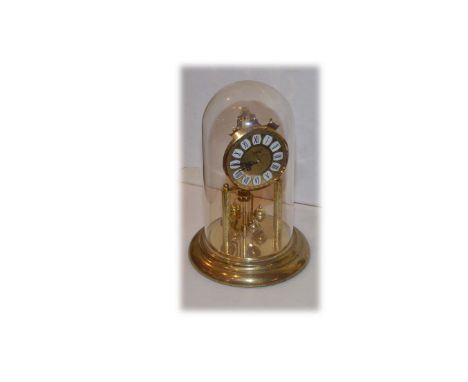 A Revolving Pendulum Mantle Clock Under Dome