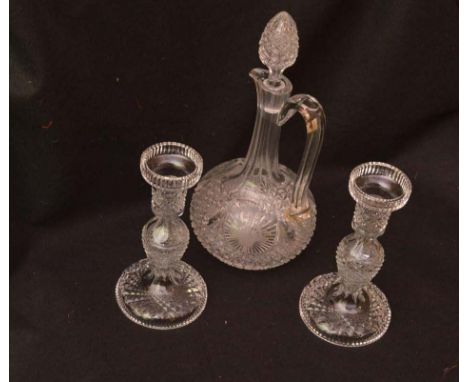 A Crystal Decanter and a Pair of Crystal Candlesticks