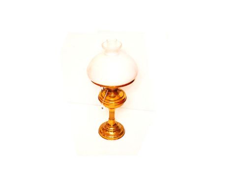 A Brass Based Oil Lamp and Shade