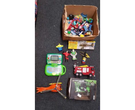 BOXED RADIO CONTROLLED STUNT TANK & A CARTON WITH MISC PLASTIC TOYS INCL; A HELICOPTER & FIRE ENGINE