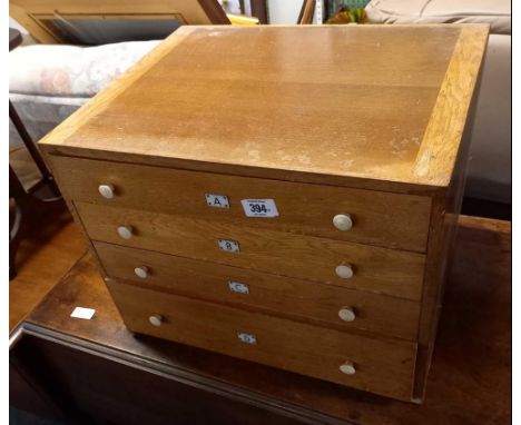 LIGHT OAK CHEST OF 4 DRAWERS (LABELED A, B, C, D) 18'' X 14'' (LABEL ON BACK  BAYKO SPARE PARTS) BUT CHEST IS EMPTY