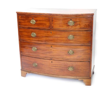 A Victorian mahogany bow fronted chest of drawers, with a plain top with a moulded edge above two short and three long drawer