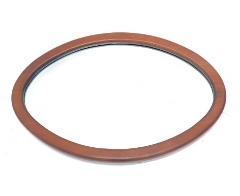 A New Zealand kauriwood oval wall mirror, with radio carbon dated certificate from The University of Waikato, 58cm x 58cm. 