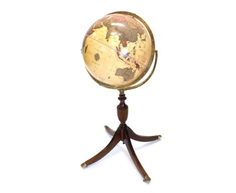 A mahogany Classica globe by The George F Cram Company of USA, with brass support, turned and reeded column, and splayed legs