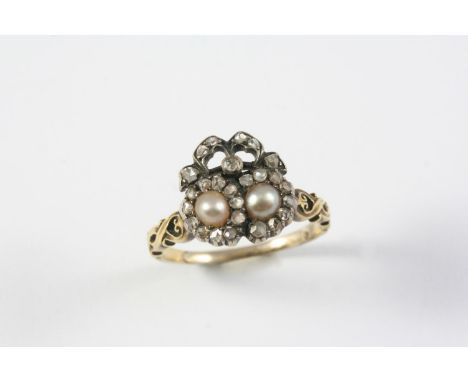 A VICTORIAN DIAMOND AND PEARL DOUBLE HEART RING mounted with two half pearls within a surround of rose-cut diamonds, with fur