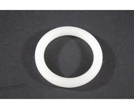 CHINESE JADE BANGLE a plain white jade bangle, 7.5cms diameter