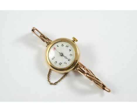 A 9CT GOLD WRISTWATCH the white enamel dial with black Arabic numerals and one red numeral at 12 o'clock, on a gold expanding