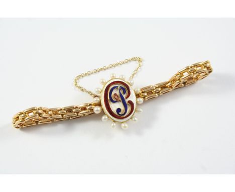 A GOLD, ENAMEL AND PEARL BRACELET the gold link bracelet mounted with an oval section of white enamel embossed with initials 