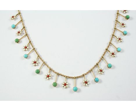 A GOLD, TURQUOISE AND ENAMEL DROP NECKLACE formed alternately with white enamel and red guilloche enamel flowerhead drops and