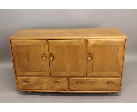 ERCOL SIDEBOARD a light elm sideboard with a two door cupboard with shelf, and a single cupboard with cutlery drawer. With tw