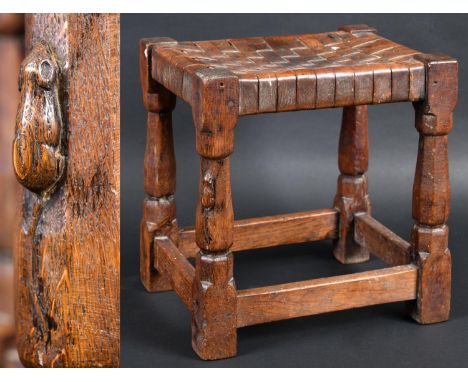 ROBERT THOMPSON OF KILBURN - MOUSEMAN STOOL an early Mouseman rectangular oak joint stool with leather lattice work seat, sup