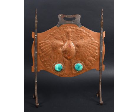 ARTS &amp; CRAFTS COPPER FIRESCREEN with a beaten copper panel designed with a peacock, and with two Ruskin style roundels. W