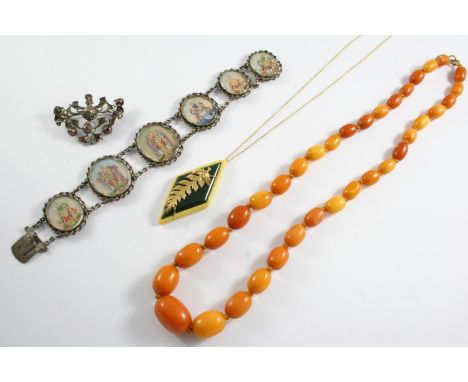 ASSORTED JEWELLERY including a graduated oval-shaped amber bead necklace, 54cm long, 31 grams, a silver and gem set openwork 