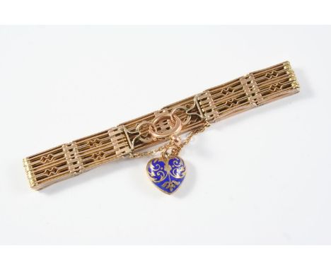 A 9CT GOLD FANCY GATE LINK BRACELET suspending a heart-shaped blue enamel charm with gold decoration, 16.5cm long, 27.5 grams