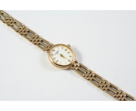 A LADY'S 9CT GOLD WRISTWATCH BY ROTARY the signed oval-shaped dial with baton numerals, on a 9ct gold gate link bracelet by R