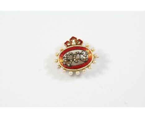 AN EARLY 20TH CENTURY ENAMEL AND DIAMOND BROOCH centred with 1903 mounted with rose-cut diamonds, within a surround of red gu