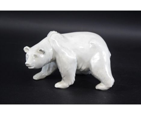 KPM BERLIN -  PORCELAIN POLAR BEAR a porcelain blanc de chine model of a striding polar bear, blue sceptre mark. 24cms long, 