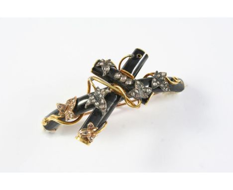 A VICTORIAN DIAMOND, BLACK ENAMEL AND GOLD MOURNING BROOCH formed as a cross, embossed with rose-cut diamond set foliate deco