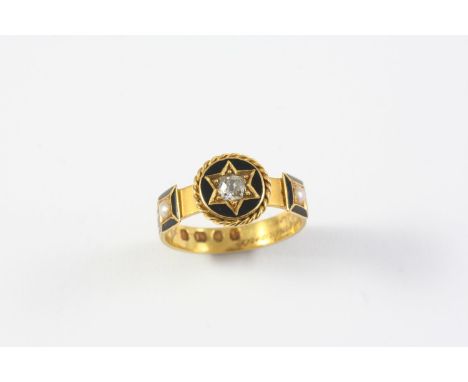 A GOLD, BLACK ENAMEL, PEARL AND DIAMOND MOURING RING the central cushion-shaped diamond set within a star motif within a blac