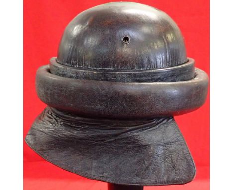 WW2 Spanish Civil War model 1935 tankers helmet. Features black padded leather body with leather neck skirt, extra round rim 