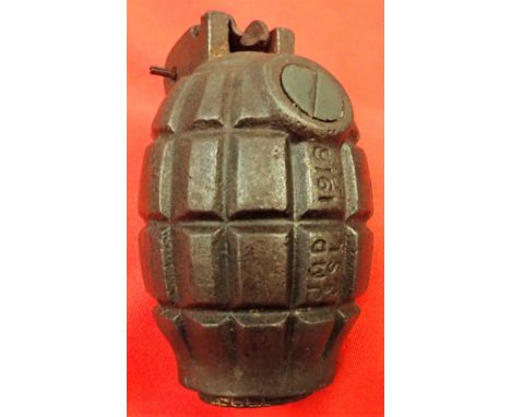 Deactivated WW1 British mills grenade marked 1918, manufactured by J.M. Doughty and Sons Ltd. Features stamping to the base p
