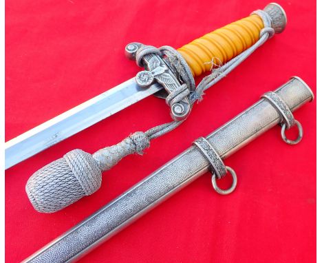 WW2 German Army officer’s dagger, scabbard &amp; knot. Orange coloured celluloid grip is in good condition with light fading 