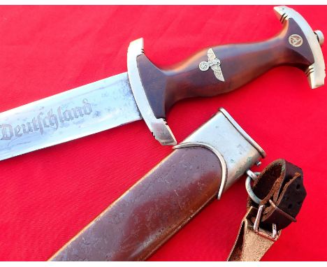 WW2 German S.A. 1933 1st pattern dagger with scabbard by Gebruder Becker of Solingen. Features mid brown wood grip, showing l