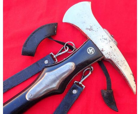 WW2 Nazi Germany fireman’s dress axe with leather covers and hangers. Features 38.5cm long black painted wood handle with nic