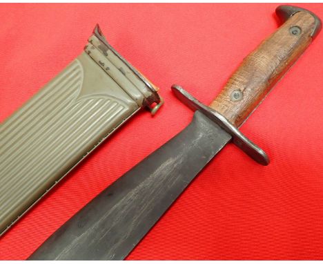 WW2 U.S. bolo knife &amp; scabbard by Plumb, St Louis. Features fixed screw moulded wooden grips with steel birds head pommel