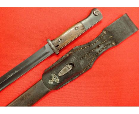 WW2 German N.S.K.K. K98 bayonet, scabbard &amp; frog by Alec Coppel. Features birds head pommel with moving locking button, s