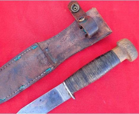 WW2 U.S. Navy U.S.N. Mk 1 fighting utility knife with scabbard. Features a stacked leather scabbard with the wooden “floating