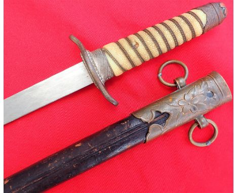 WW2 Imperial Japanese naval dirk with scabbard. 1930’s era IJN faux ray skin handle with wire twists, brass pommel and guard.