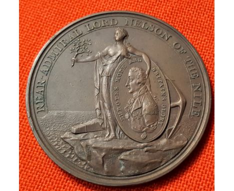 Battle of the Nile Medal 1798. A copper medal by C.H. Küchler for A. Davisson, Peace holds shield with medallic portrait of N