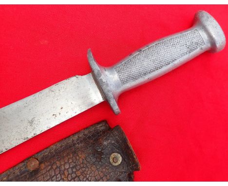 WW2 Vichy French knife & scabbard by Sabatier. Features cast alloy chequered hilt with a 15cm steel blade. The blade is light