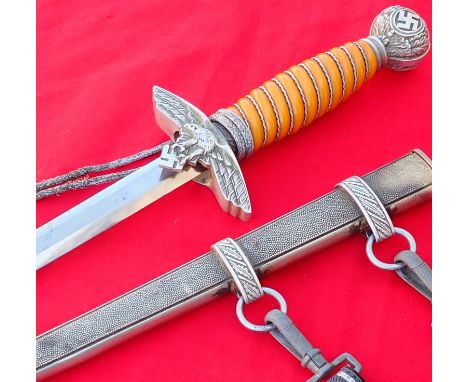 WW2 German Luftwaffe Officers 2nd pattern dagger, with scabbard knot and hangers by S.M.F. Features orange coloured celluloid