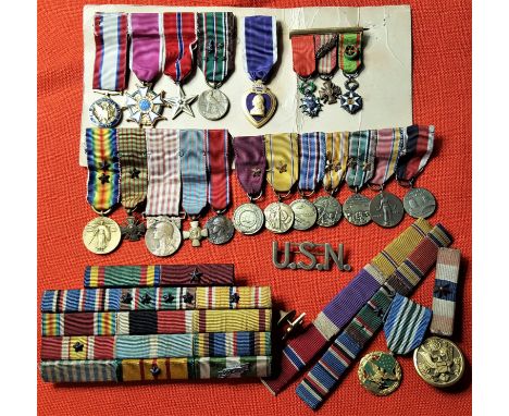Lot of U.S. military medal ribbons and miniatures (29). 4 x Miniature groups, 2 loose miniatures, 4 ribbon bars, USN pin, fla