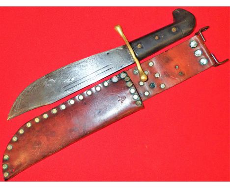 Features black grip with 3 brass rivets and brass guard. 23.5cm bowie style blade with period edge sharpening and surface cle