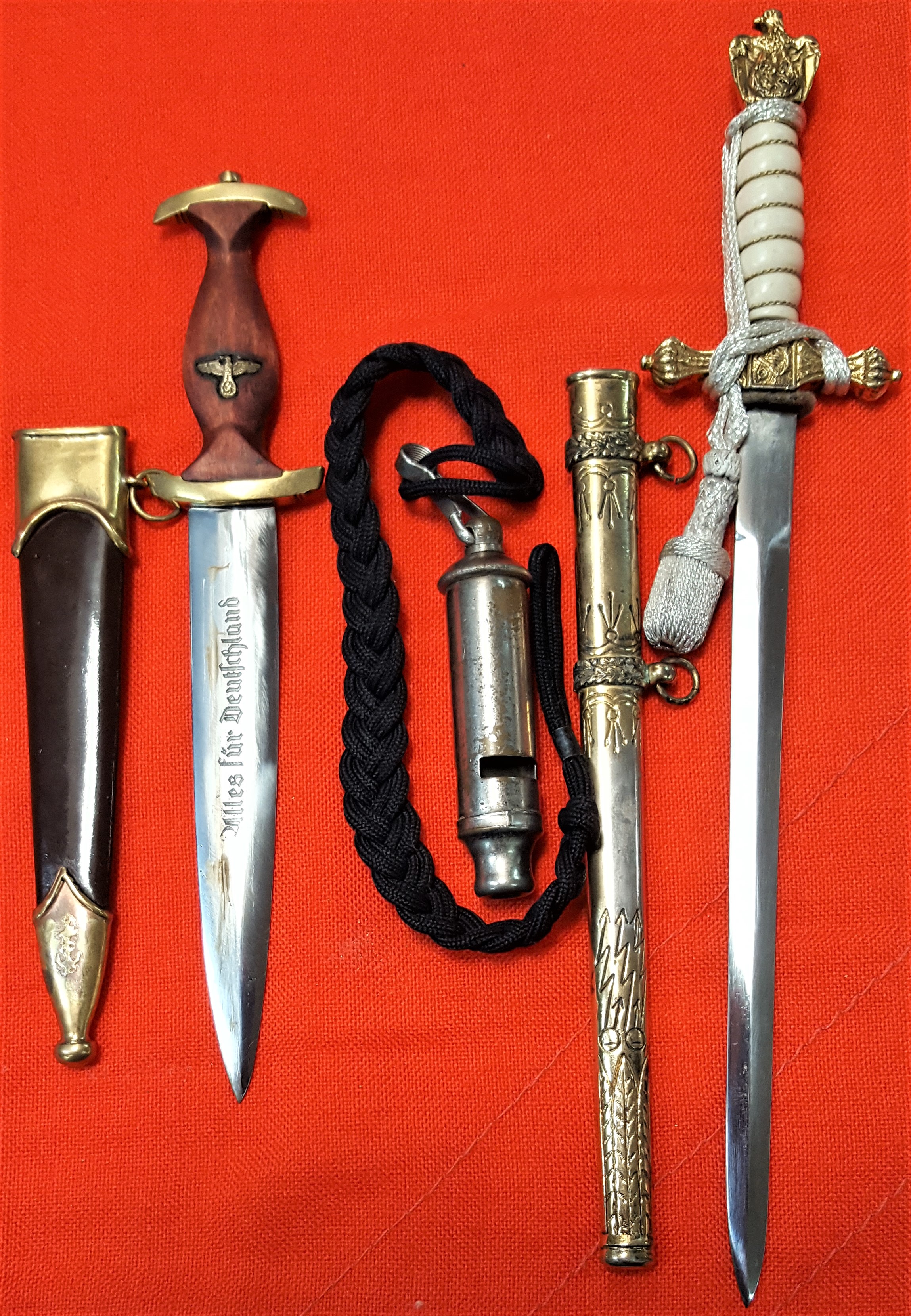 Lot of WW2 German replica miniature daggers & insignia (5). Includes SA ...