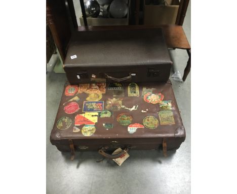 Two Vintage Suitcases with Luggage Labels and Stickers
