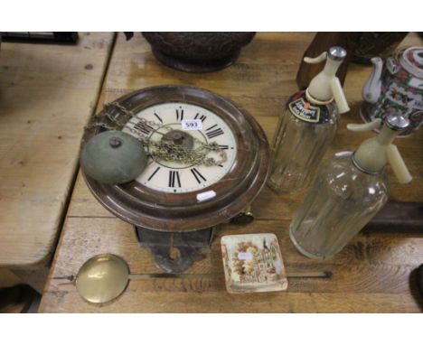 19th century Circular Wall Clock with Hanging Pendulum and Weights and Cream and Pink Face plus Two Vintage Schweppes Soda Sy