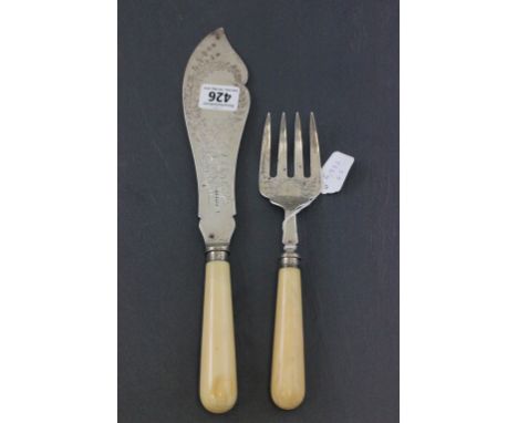 Victorian Fish Serving Knife and Fork Set, the silver blades with foliate engraving and silver collars and ivory handles, She