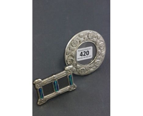 Two silver easel back picture frames one with enamel