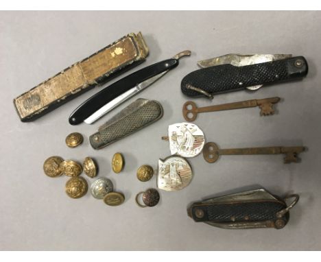 Various Military Buttons, Three Penknives, Cut Throat Razor, Mother of Pearl Belt Buckle, Three Co-op 2lb Tokens, Two G W R K